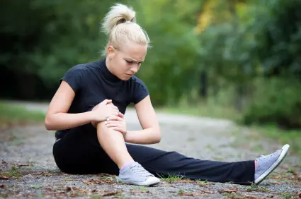 Woman with Sore Knee in need of acupucture