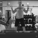 Man in Gym doing squats