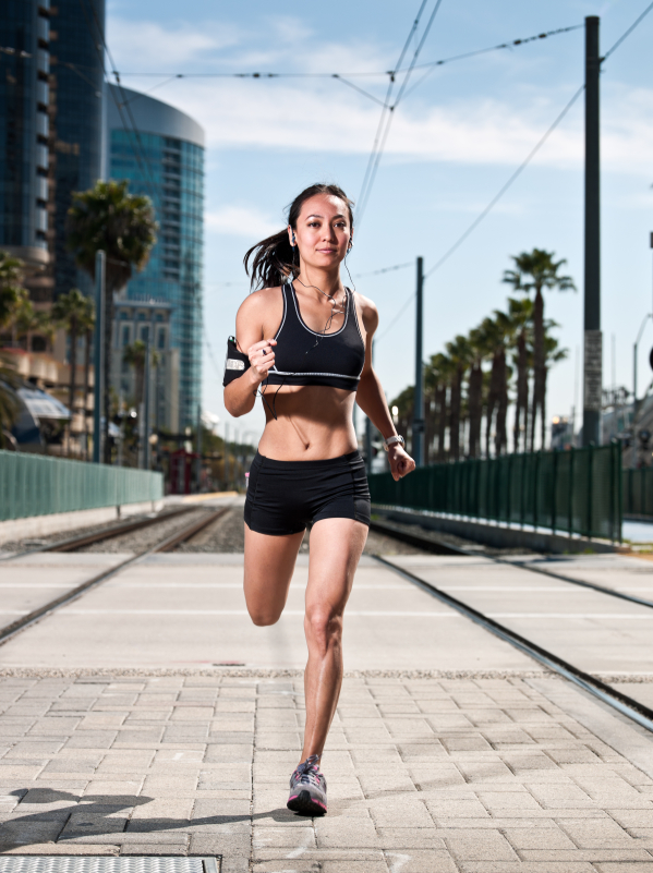 Fit woman running in town