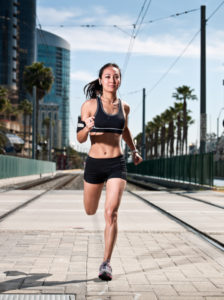 Woman running in a city