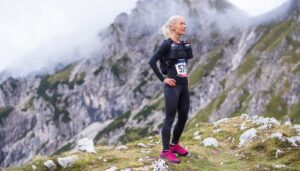 Older woman running mountain